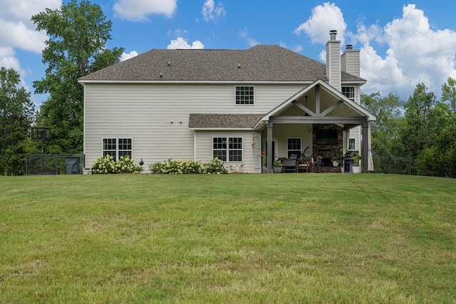 221 Abberly Ln, Ellerslie, GA 31807 - back of property with a chimney, roof with shingles, and a patio
