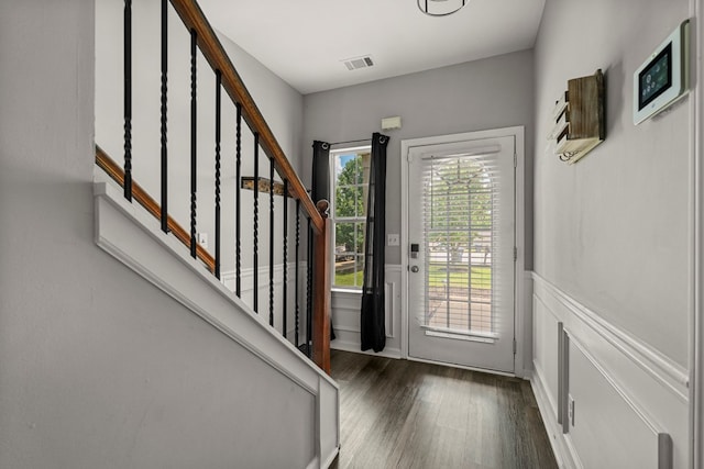 917 Dawkins Ct, Phenix City, AL 36867 - entryway featuring wood finished floors, stairway, wainscoting, and a decorative wall