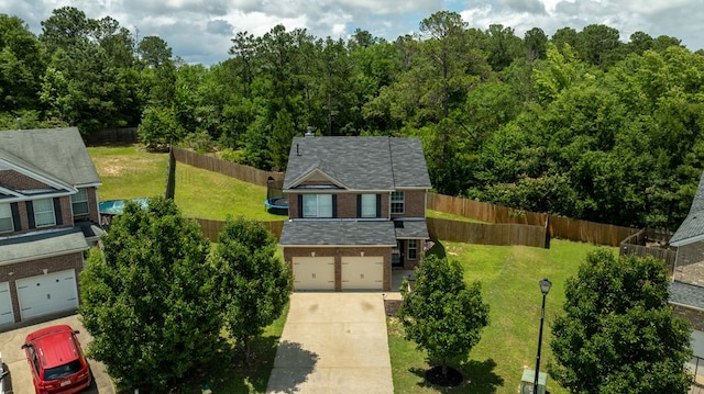 917 Dawkins Ct, Phenix City, AL 36867 - aerial view of property and surrounding area with a heavily wooded area
