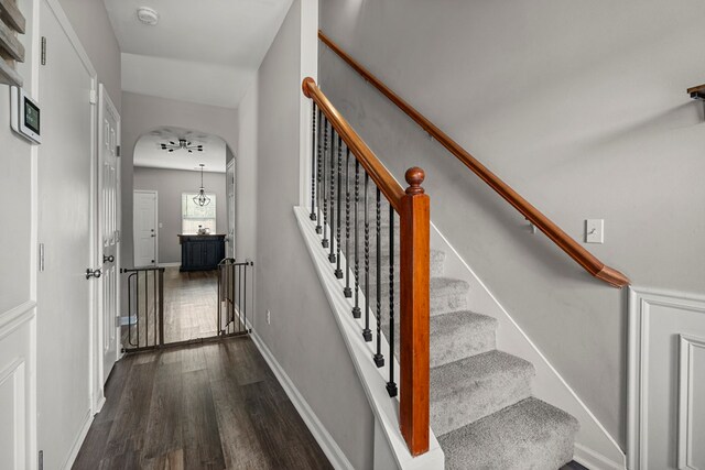 917 Dawkins Ct, Phenix City, AL 36867 - staircase featuring wood finished floors, arched walkways, and baseboards