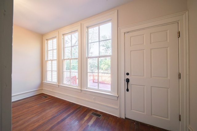 doorway featuring dark hardwood / wood-style floors