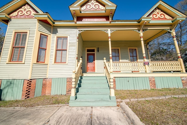 victorian-style house featuring a porch