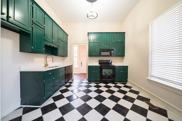 kitchen featuring green cabinetry, sink, and black appliances