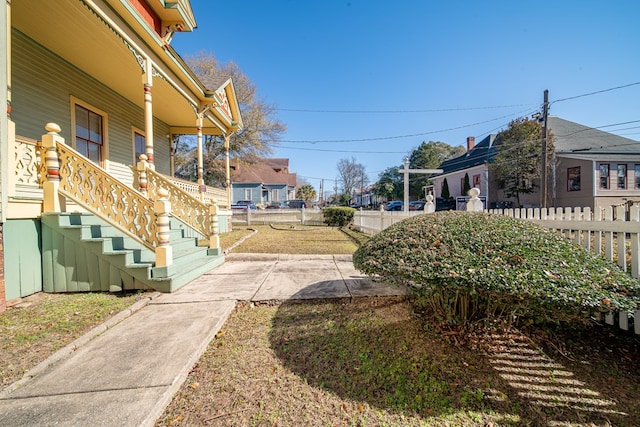 view of home's community featuring a lawn