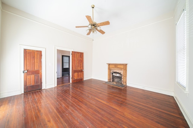 unfurnished living room featuring ceiling fan, high vaulted ceiling, crown molding, and dark hardwood / wood-style flooring