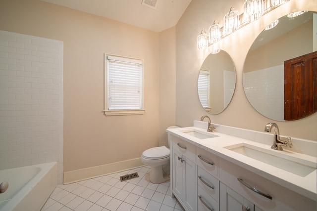 bathroom featuring tile patterned floors, toilet, and vanity