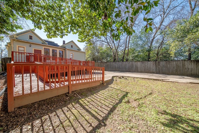 view of yard with a wooden deck and a patio area