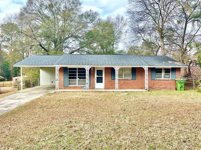 ranch-style home with a carport and a front lawn