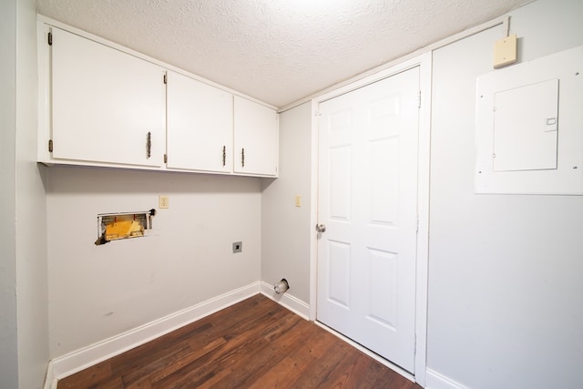 laundry room featuring electric panel, dark hardwood / wood-style floors, cabinets, a textured ceiling, and hookup for an electric dryer