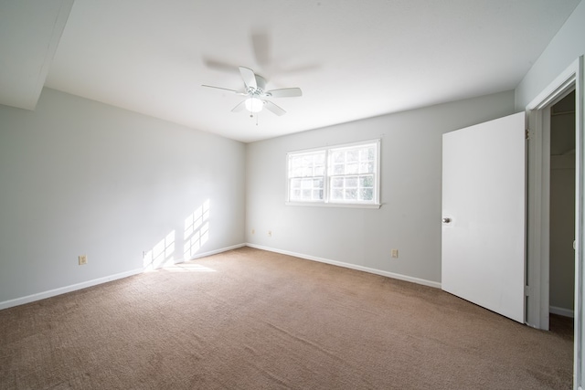 unfurnished bedroom with carpet floors and ceiling fan