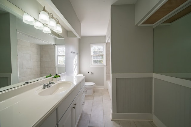 bathroom with vanity, toilet, and tile patterned flooring