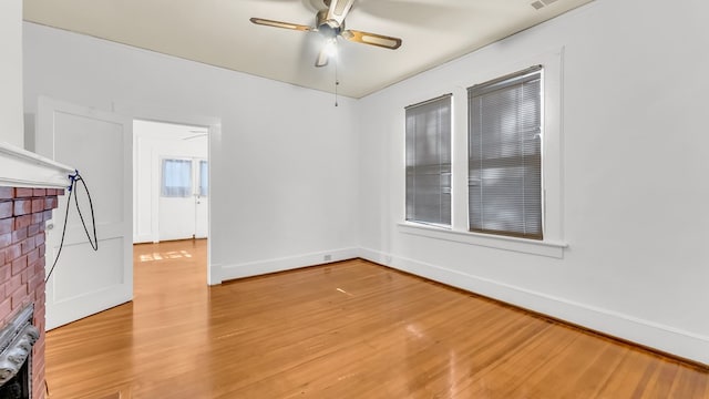 unfurnished room with wood-type flooring and ceiling fan