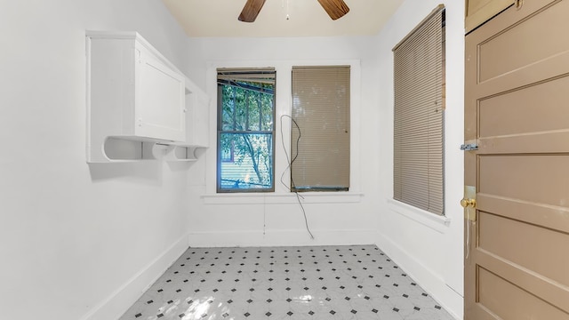 interior space with ceiling fan