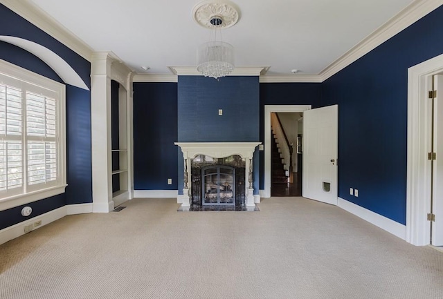 unfurnished living room featuring baseboards, carpet floors, a premium fireplace, and crown molding