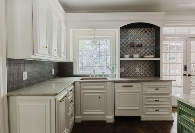 kitchen with ornamental molding, a sink, light stone countertops, open shelves, and backsplash