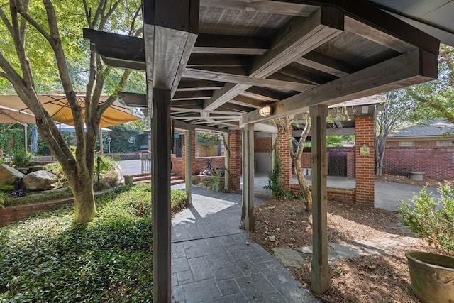 view of patio featuring fence