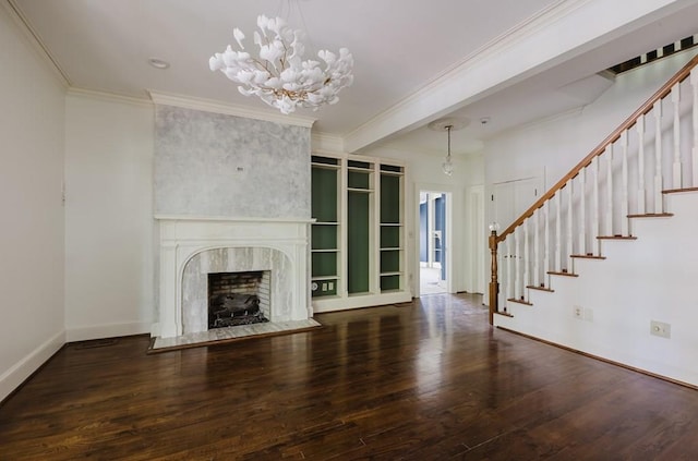 unfurnished living room featuring dark wood-style floors, crown molding, stairway, a large fireplace, and baseboards