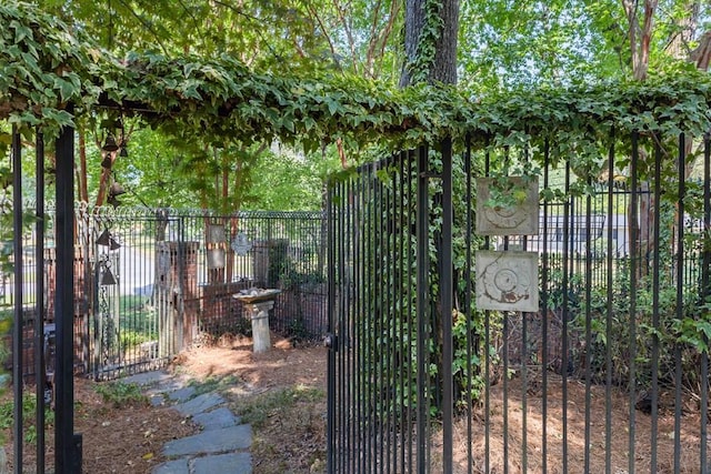 view of gate featuring fence