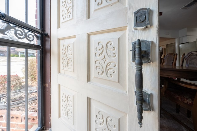 details featuring visible vents and fridge