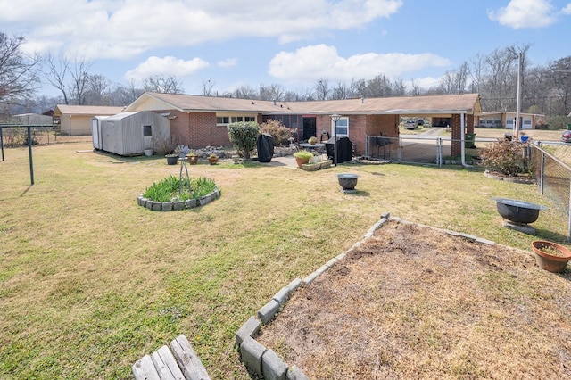 rear view of house featuring a fenced backyard, a lawn, and brick siding