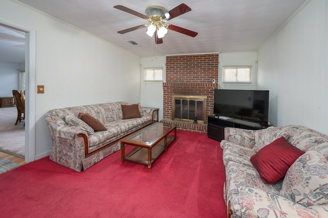 living room featuring carpet, plenty of natural light, visible vents, and ornamental molding