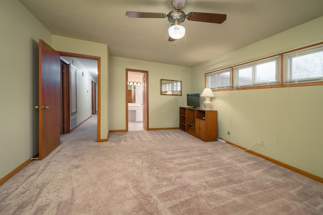 unfurnished bedroom featuring ceiling fan, carpet, connected bathroom, and baseboards