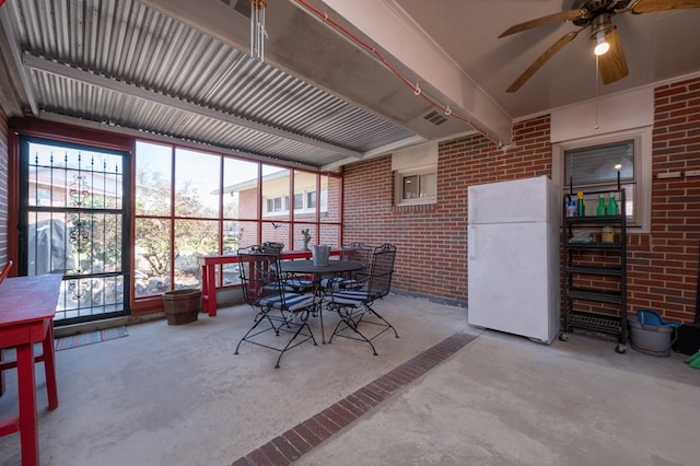 sunroom with beamed ceiling