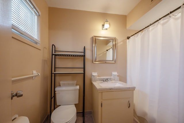 full bathroom featuring vanity and toilet