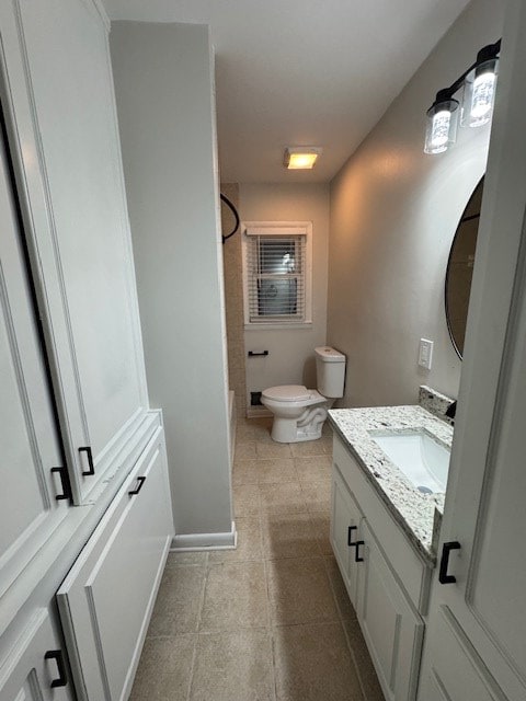 full bath with bathing tub / shower combination, baseboards, toilet, and vanity