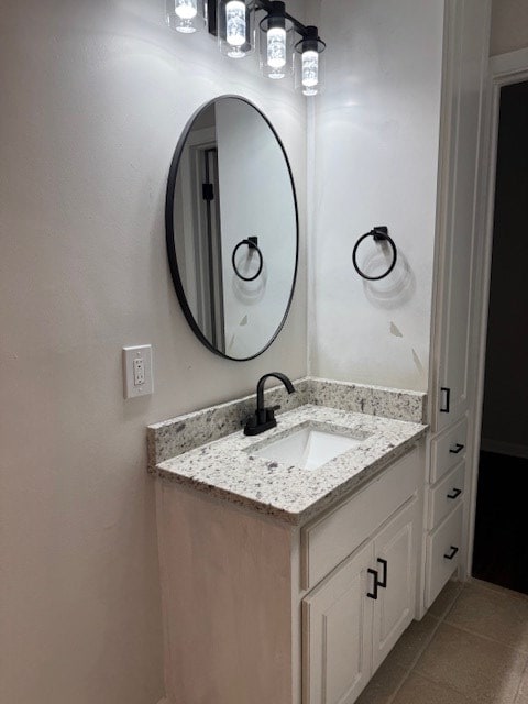 bathroom with tile patterned floors and vanity