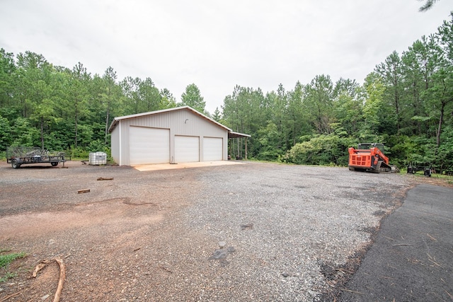 11602 Ga Highway 0085, Waverly Hall, GA 31831 - detached garage featuring a forest view