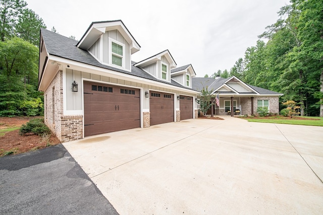 11602 Ga Highway 0085, Waverly Hall, GA 31831 - view of front of property featuring driveway, a garage, brick siding, and board and batten siding