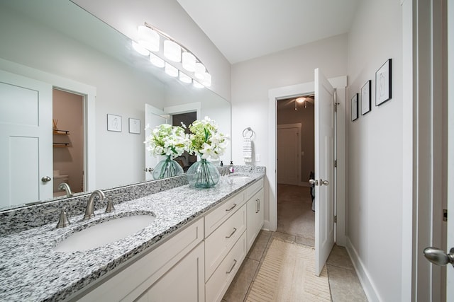 11602 Ga Highway 0085, Waverly Hall, GA 31831 - bathroom featuring double vanity, tile patterned floors, and baseboards
