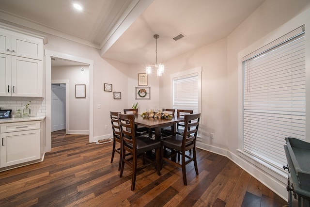 11602 Ga Highway 0085, Waverly Hall, GA 31831 - dining room with dark wood finished floors, a chandelier, ornamental molding, and baseboards