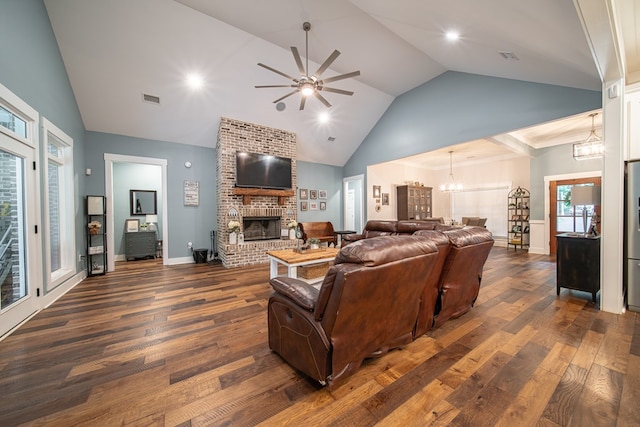 11602 Ga Highway 0085, Waverly Hall, GA 31831 - living area featuring a chandelier, dark wood-style flooring, a brick fireplace, ceiling fan, and high vaulted ceiling