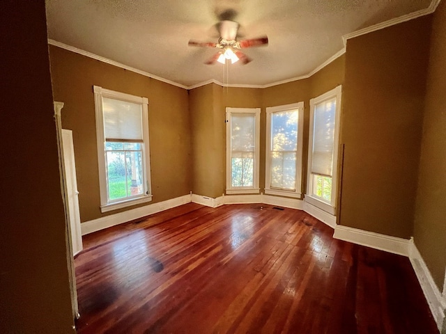 spare room with wood-type flooring, a textured ceiling, ceiling fan, and crown molding