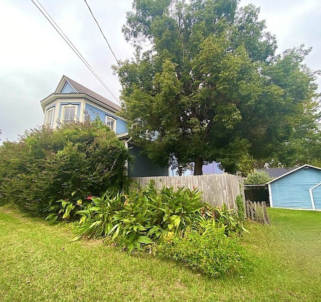 view of home's exterior featuring a yard