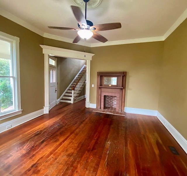 unfurnished living room featuring ceiling fan, dark wood-type flooring, and ornamental molding