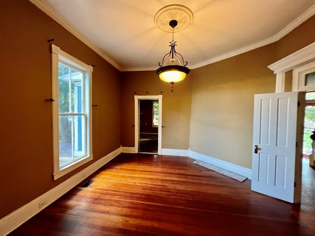 interior space featuring ornamental molding and hardwood / wood-style flooring