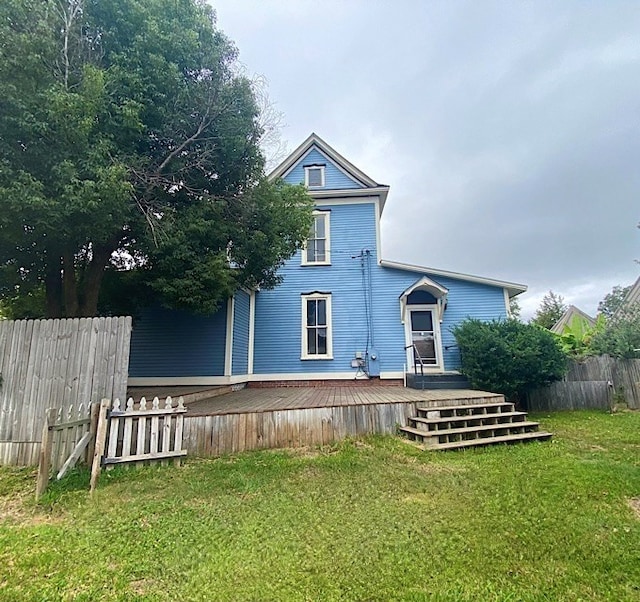 exterior space featuring a front yard and a deck