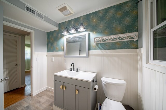 22 Oak Dr, Pine Mountain, GA 31822 - bathroom with vanity, wood finished floors, ornamental molding, wainscoting, and wallpapered walls
