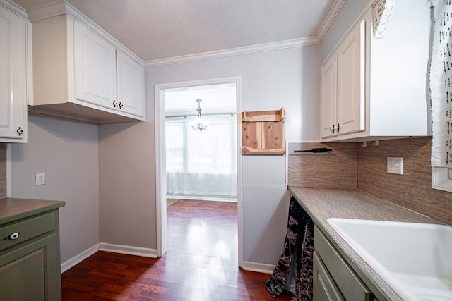22 Oak Dr, Pine Mountain, GA 31822 - kitchen featuring dark wood finished floors, white cabinets, ornamental molding, a chandelier, and light countertops