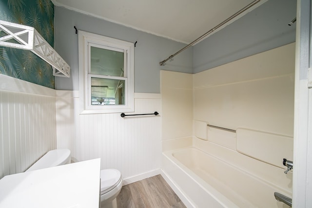 22 Oak Dr, Pine Mountain, GA 31822 - bathroom featuring a wainscoted wall, wood finished floors, and shower / tub combination