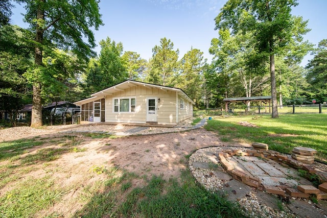 22 Oak Dr, Pine Mountain, GA 31822 - back of property featuring a patio area, view of wooded area, and board and batten siding