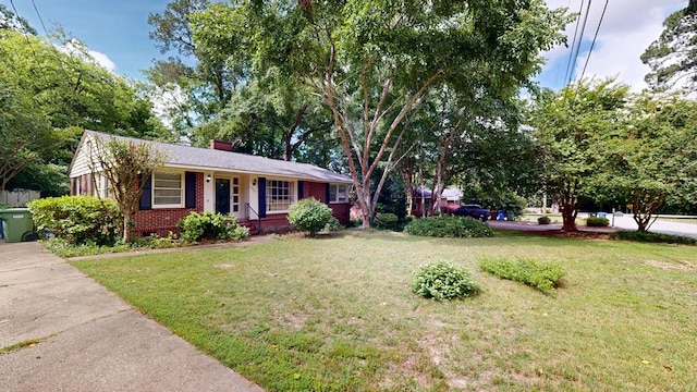 3224 Carden Dr, Columbus, GA 31907 - single story home featuring brick siding, a front lawn, a chimney, and covered porch