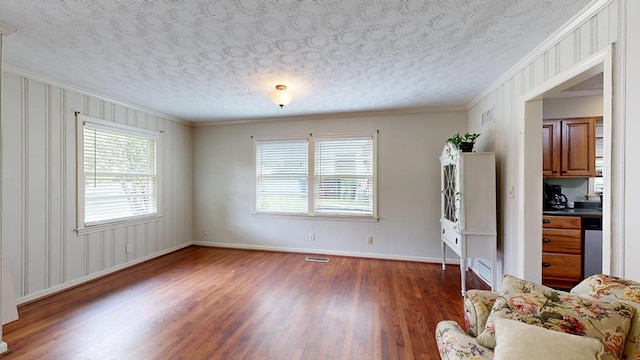 3224 Carden Dr, Columbus, GA 31907 - living room with wood finished floors, ornamental molding, and a textured ceiling