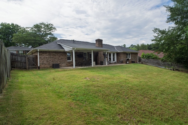2 Labrador Ct, Columbus, GA 31909 - rear view of property featuring a chimney, a patio area, a fenced backyard, and brick siding