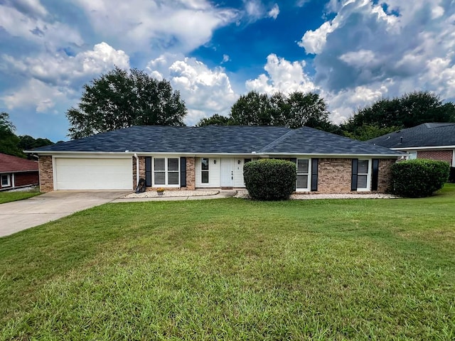 2 Labrador Ct, Columbus, GA 31909 - single story home with concrete driveway, brick siding, an attached garage, and a front yard
