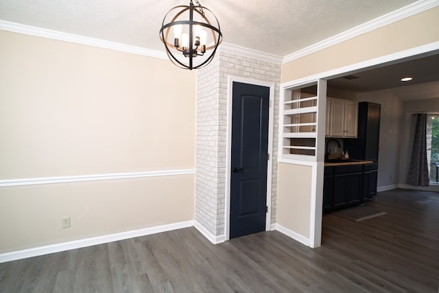 2 Labrador Ct, Columbus, GA 31909 - unfurnished dining area featuring a chandelier, dark wood-style floors, ornamental molding, and a textured ceiling