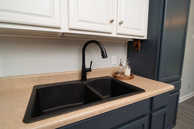 2 Labrador Ct, Columbus, GA 31909 - detailed view of white cabinetry, light countertops, and wood finished floors